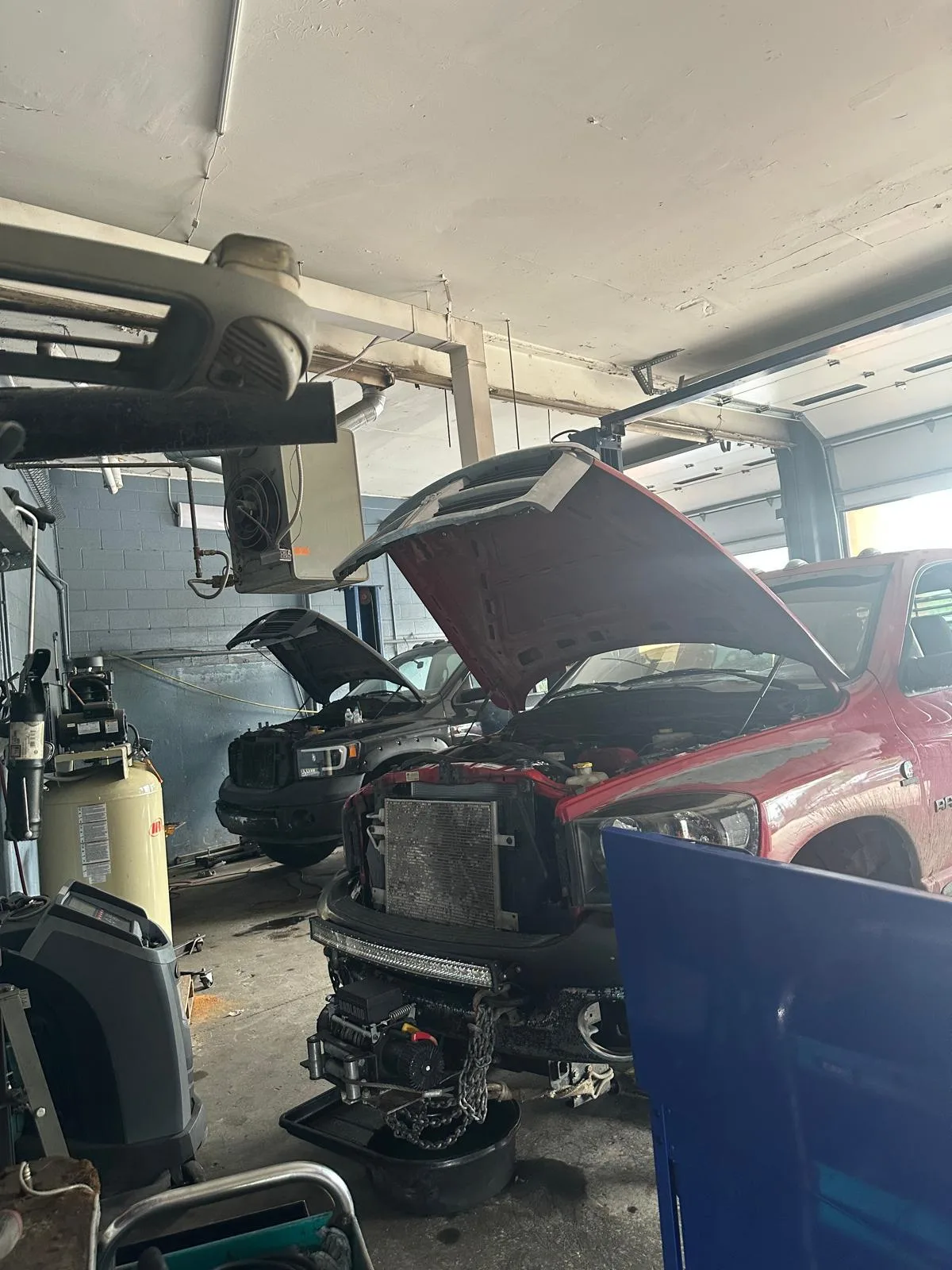 RAM pickup undergoing engine service inside Villeda’s Workshop