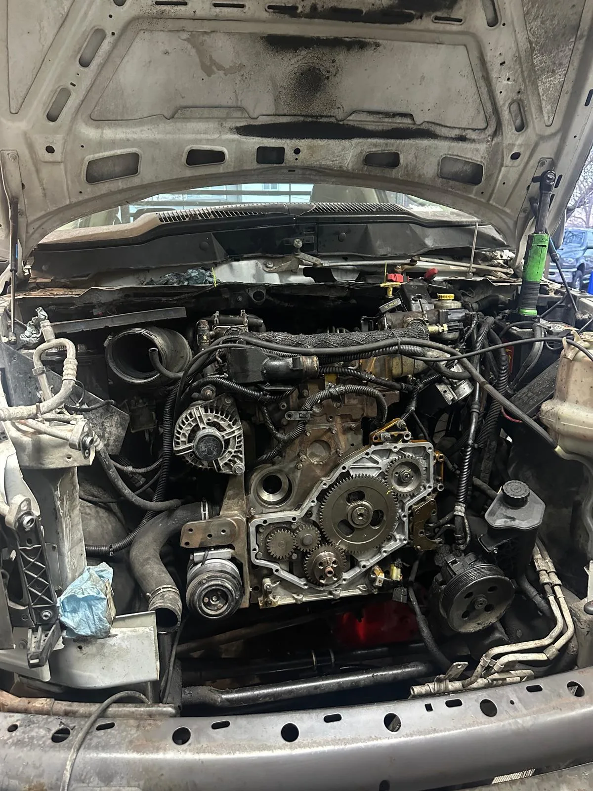 Diesel engine gear service in progress on a work truck